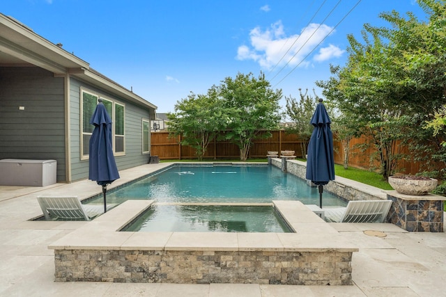 31013 Sunfall Trail Ln, Spring, TX 77386 - view of pool with a fenced backyard, a pool with connected hot tub, and a patio