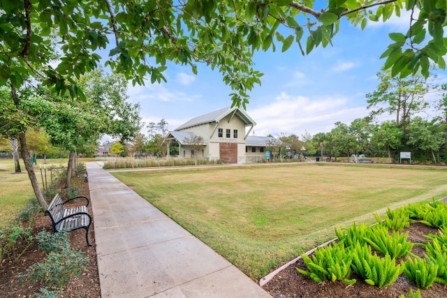 17533 Rosette Grass Dr, Conroe, TX 77385 - view of property's community with a lawn