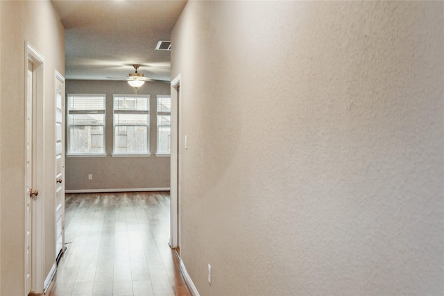 17533 Rosette Grass Dr, Conroe, TX 77385 - corridor with wood finished floors and baseboards