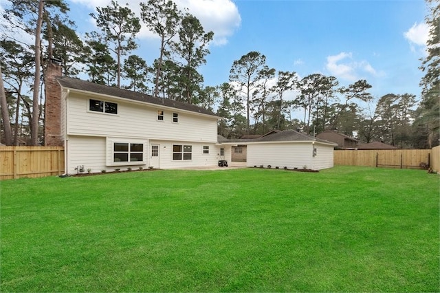 8018 Twining Oaks Ln, Spring, TX 77379 - rear view of property featuring a fenced backyard, a chimney, and a patio