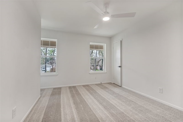 8018 Twining Oaks Ln, Spring, TX 77379 - empty room with healthy amount of natural light, a ceiling fan, and light carpet