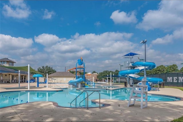8018 Twining Oaks Ln, Spring, TX 77379 - community pool featuring a water slide, a water play area, a patio, and a hot tub