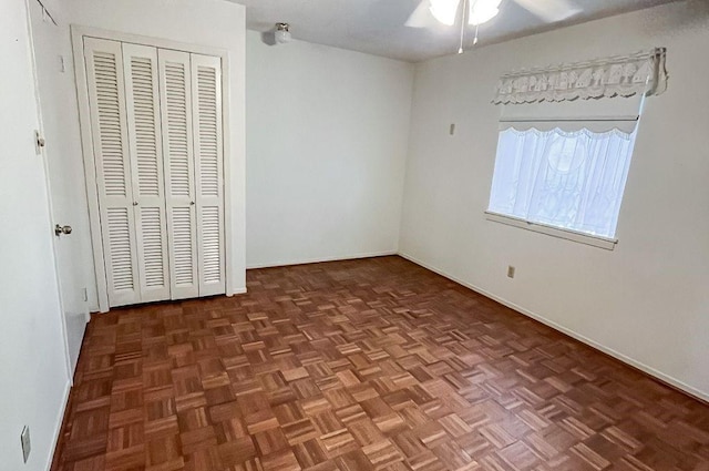 1092 S Holland St, Bellville, TX 77418 - unfurnished bedroom featuring a closet and a ceiling fan