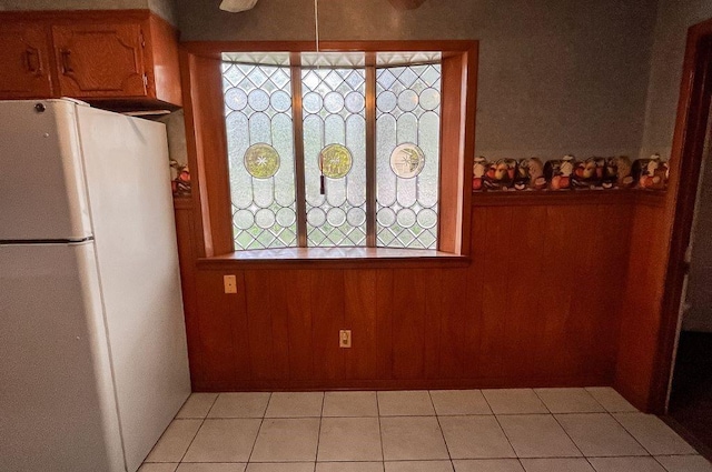 1092 S Holland St, Bellville, TX 77418 - unfurnished dining area featuring light tile patterned floors