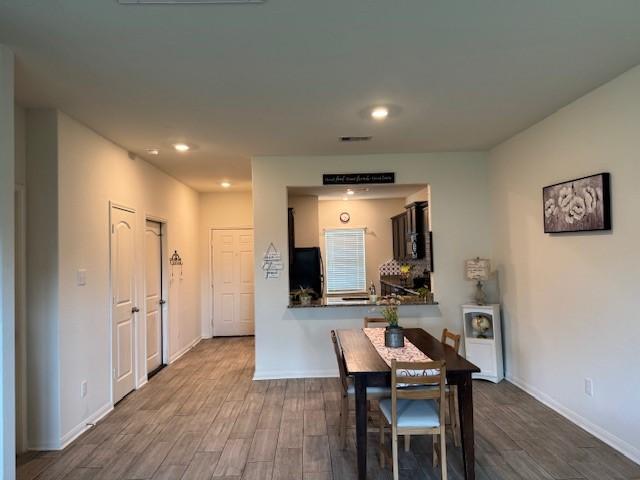 1017 Misty Patch Dr, Katy, TX 77493 - dining space featuring dark wood-style flooring and recessed lighting