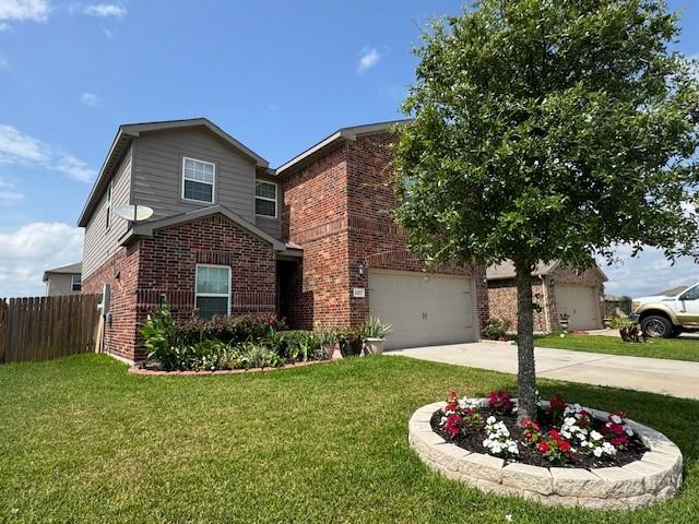 1017 Misty Patch Dr, Katy, TX 77493 - view of front of property with brick siding, driveway, and a garage