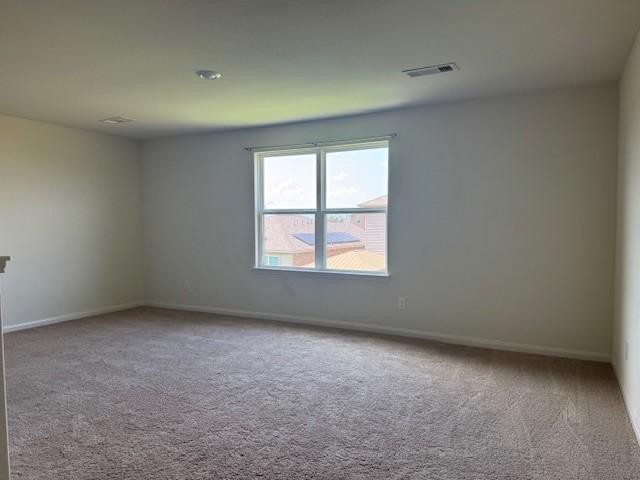 1017 Misty Patch Dr, Katy, TX 77493 - carpeted empty room featuring baseboards