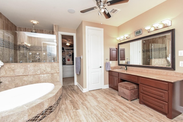 19510 Cisco Ct, Cypress, TX 77433 - bathroom featuring a stall shower, ceiling fan, vanity, and a garden tub