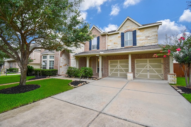 19510 Cisco Ct, Cypress, TX 77433 - view of front of home featuring driveway, an attached garage, a front yard, stone siding, and brick siding