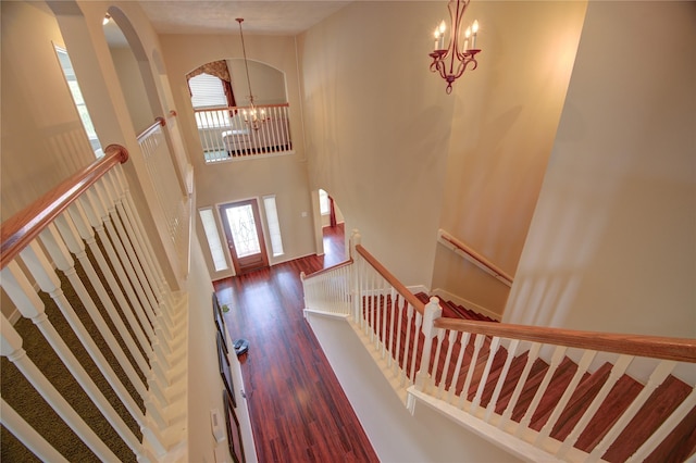 18719 Glenn Haven Estates Dr, Spring, TX 77379 - entryway with a chandelier, wood finished floors, and a towering ceiling