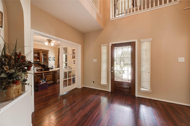 18719 Glenn Haven Estates Dr, Spring, TX 77379 - entrance foyer featuring dark wood-type flooring, a towering ceiling, a ceiling fan, french doors, and arched walkways