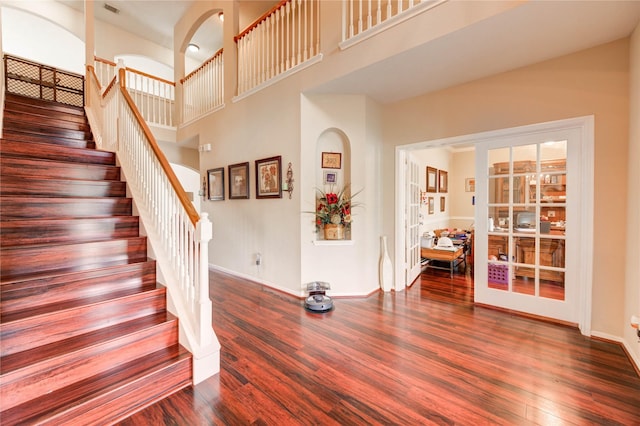 18719 Glenn Haven Estates Dr, Spring, TX 77379 - stairs with wood finished floors and a towering ceiling