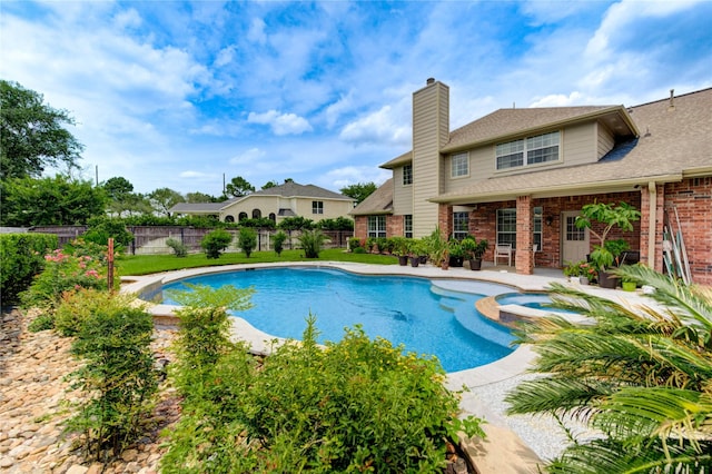 18719 Glenn Haven Estates Dr, Spring, TX 77379 - view of swimming pool with a pool with connected hot tub, a fenced backyard, and a patio