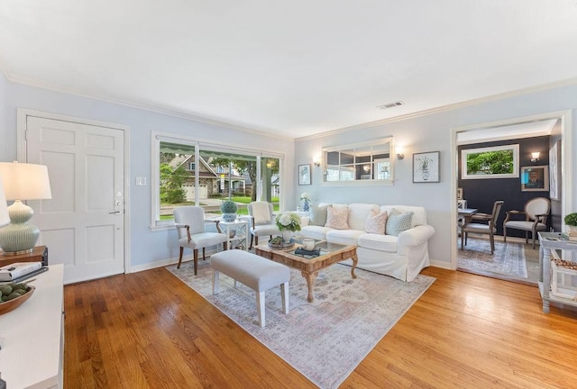 1726 Saxon Dr, Houston, TX 77018 - living room with crown molding and light wood-style floors