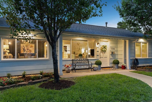 1726 Saxon Dr, Houston, TX 77018 - rear view of house with covered porch, a shingled roof, and a yard