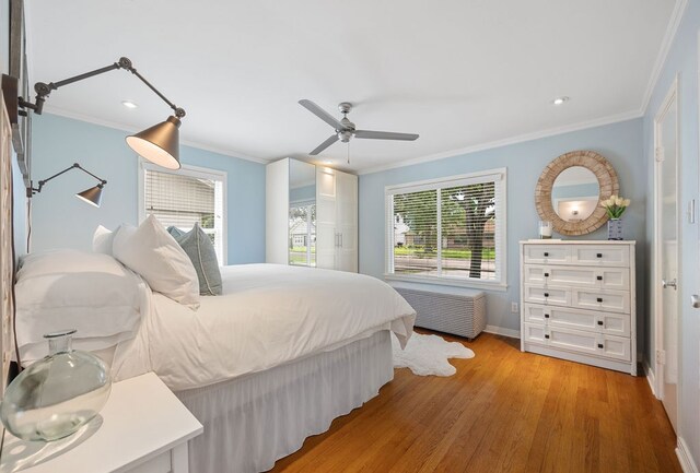 1726 Saxon Dr, Houston, TX 77018 - bedroom featuring crown molding, light wood-style floors, radiator, ceiling fan, and recessed lighting