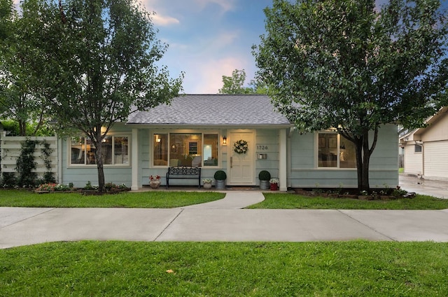 1726 Saxon Dr, Houston, TX 77018 - view of front of house featuring a front yard and a shingled roof