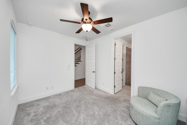 861 Dunleigh Meadows Ln, Houston, TX 77055 - sitting room with a ceiling fan, carpet, and stairs