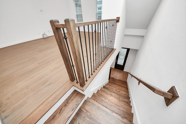861 Dunleigh Meadows Ln, Houston, TX 77055 - stairs with wood finished floors and baseboards