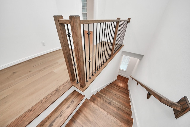 861 Dunleigh Meadows Ln, Houston, TX 77055 - staircase with wood finished floors and baseboards
