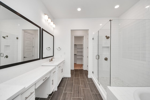 861 Dunleigh Meadows Ln, Houston, TX 77055 - bathroom with vanity, a shower stall, recessed lighting, a walk in closet, and a bathtub