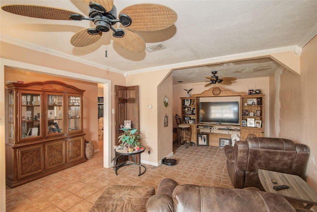 516 W Mimosa St, Angleton, TX 77515 - living room featuring a ceiling fan, ornamental molding, light tile patterned floors, and arched walkways