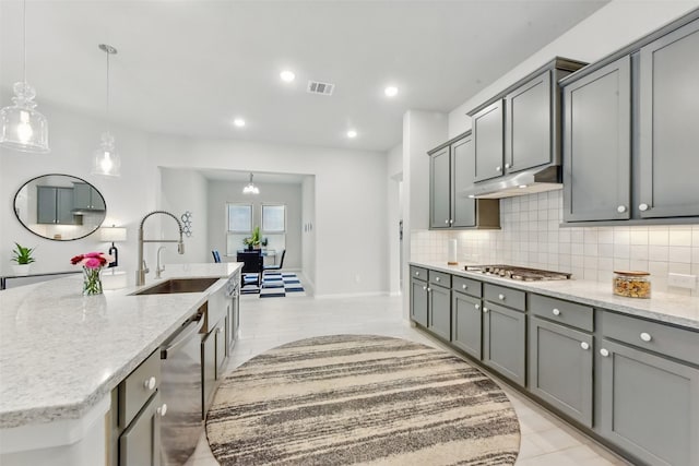250 Peninsula Point Dr, Montgomery, TX 77356 - kitchen with appliances with stainless steel finishes, under cabinet range hood, gray cabinets, and recessed lighting