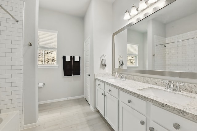 250 Peninsula Point Dr, Montgomery, TX 77356 - full bathroom with double vanity, healthy amount of natural light, washtub / shower combination, and wood finished floors