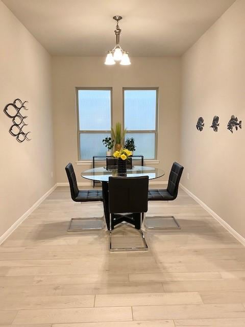 250 Peninsula Point Dr, Montgomery, TX 77356 - dining room featuring light wood-style flooring and a chandelier