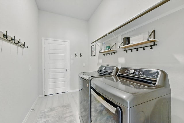 250 Peninsula Point Dr, Montgomery, TX 77356 - laundry room featuring washer and clothes dryer and light wood finished floors