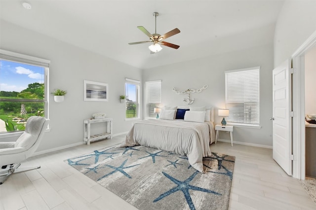 250 Peninsula Point Dr, Montgomery, TX 77356 - bedroom with multiple windows, light wood-style flooring, and a ceiling fan