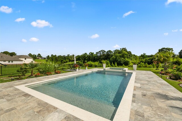 250 Peninsula Point Dr, Montgomery, TX 77356 - view of swimming pool with a patio area, a pool with connected hot tub, and view of wooded area