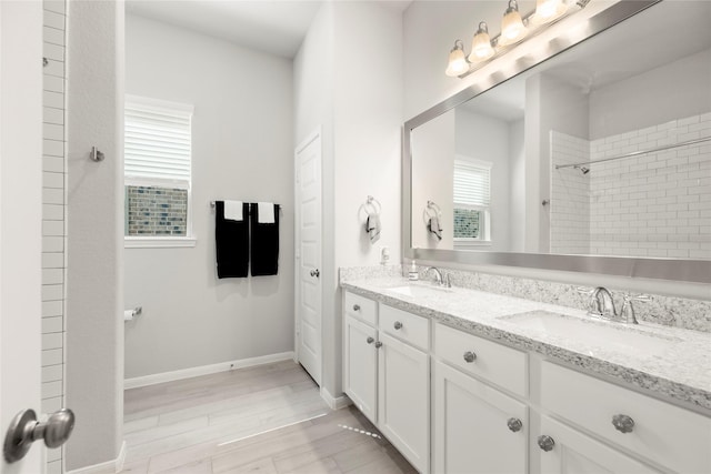 250 Peninsula Point Dr, Montgomery, TX 77356 - full bathroom with double vanity and wood finished floors