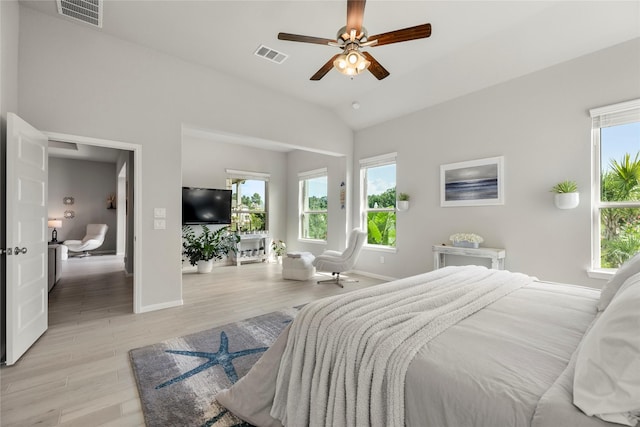 250 Peninsula Point Dr, Montgomery, TX 77356 - bedroom featuring light wood-style flooring, vaulted ceiling, and ceiling fan