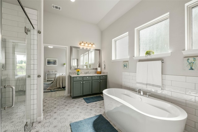 250 Peninsula Point Dr, Montgomery, TX 77356 - bathroom with vanity, a soaking tub, and a shower stall
