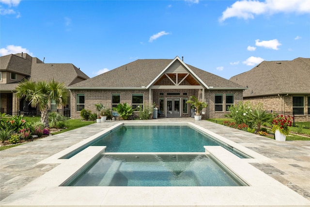 250 Peninsula Point Dr, Montgomery, TX 77356 - view of swimming pool featuring french doors, a pool with connected hot tub, and a patio