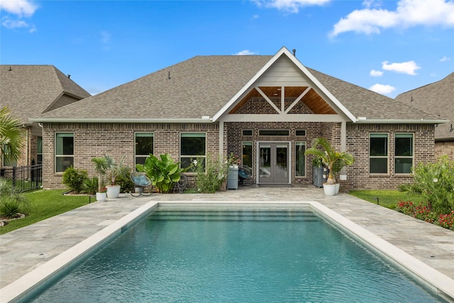 250 Peninsula Point Dr, Montgomery, TX 77356 - rear view of property featuring french doors, brick siding, and a shingled roof