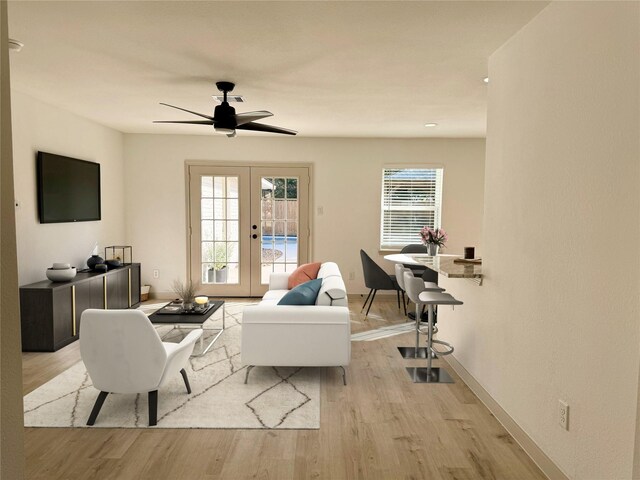 5503 Duxbury St, Houston, TX 77035 - living room featuring french doors, light wood-style floors, and ceiling fan