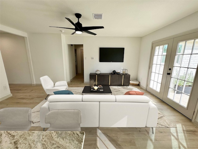 5503 Duxbury St, Houston, TX 77035 - living area with french doors, light wood finished floors, and ceiling fan