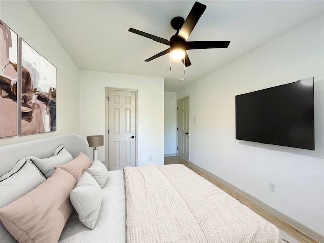 5503 Duxbury St, Houston, TX 77035 - bedroom with a ceiling fan and light wood-style flooring