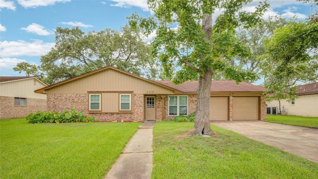 110 Spruce St, Lake Jackson, TX 77566 - ranch-style home with brick siding, a garage, concrete driveway, and a front yard