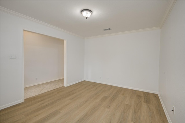 110 Spruce St, Lake Jackson, TX 77566 - spare room featuring crown molding and light wood-style floors