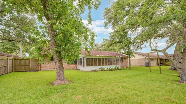 110 Spruce St, Lake Jackson, TX 77566 - view of yard with a sunroom and a gate