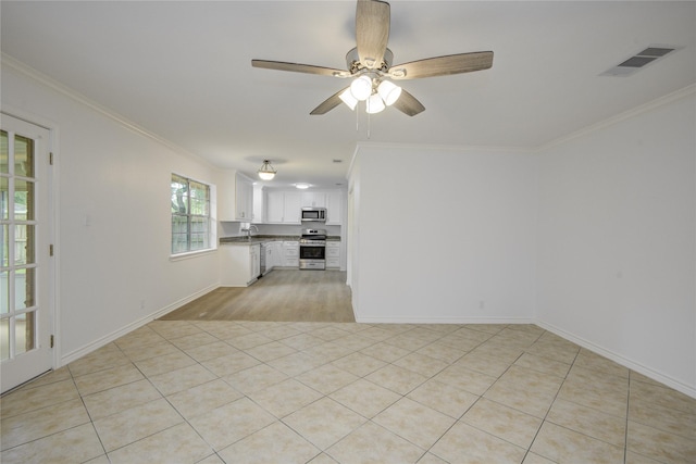 110 Spruce St, Lake Jackson, TX 77566 - unfurnished living room with ornamental molding, a ceiling fan, and light tile patterned floors