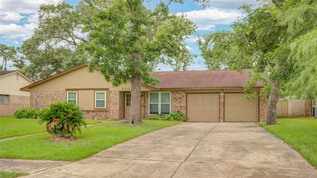 110 Spruce St, Lake Jackson, TX 77566 - single story home with brick siding, concrete driveway, and an attached garage