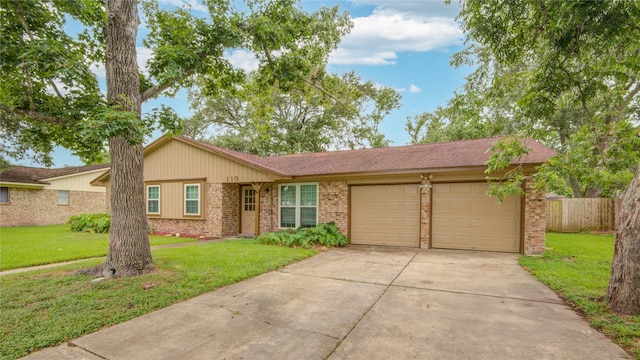 110 Spruce St, Lake Jackson, TX 77566 - single story home with brick siding, a garage, and concrete driveway