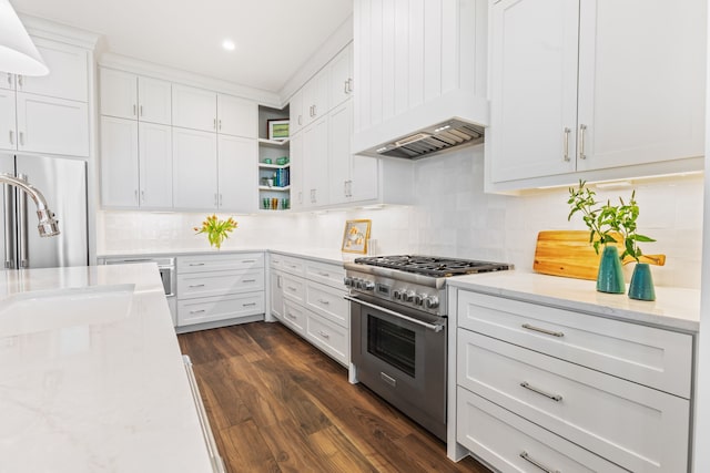 742 Positano Rd, Galveston, TX 77550 - kitchen featuring stainless steel stove, open shelves, premium range hood, decorative backsplash, and white cabinets