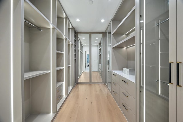 507 W Bell, Houston, TX 77019 - spacious closet featuring light wood-type flooring