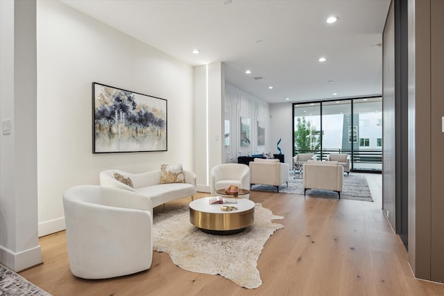 507 W Bell, Houston, TX 77019 - living room with light wood-style floors, recessed lighting, and floor to ceiling windows