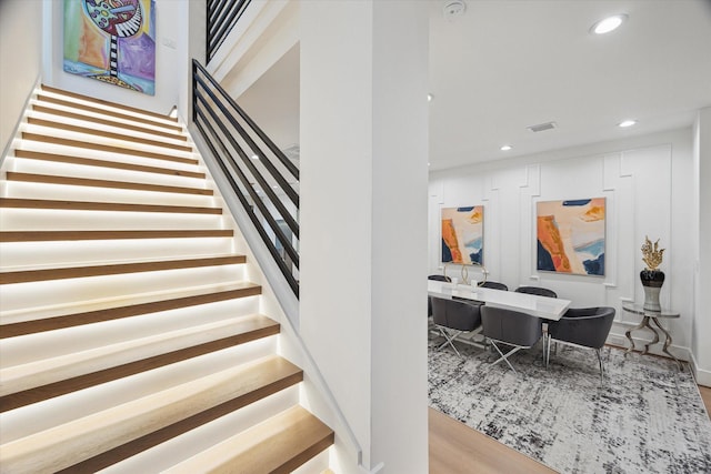 507 W Bell, Houston, TX 77019 - stairs featuring recessed lighting and wood finished floors